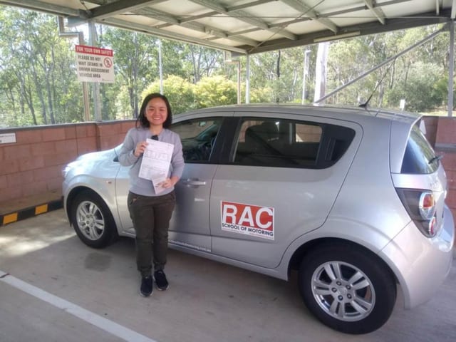 Learner beside a silver RAC learner car